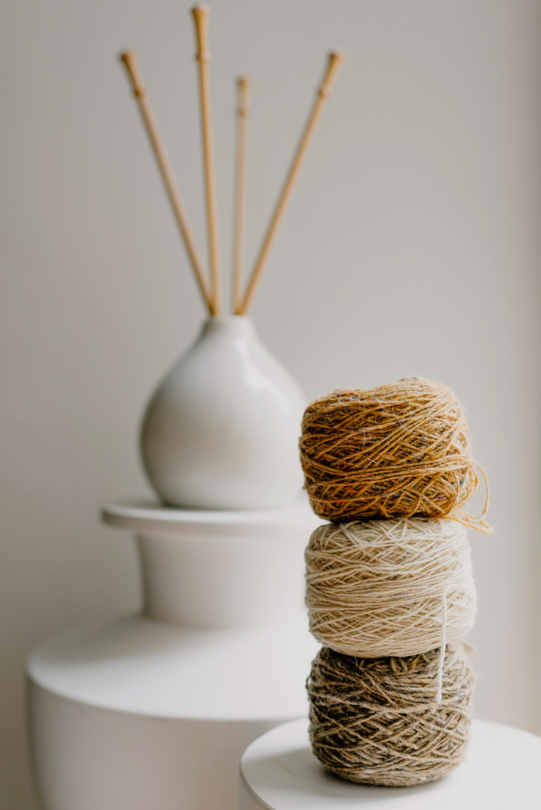 Close-Up Shot of Stack of Assorted Rolled Sewing Threads